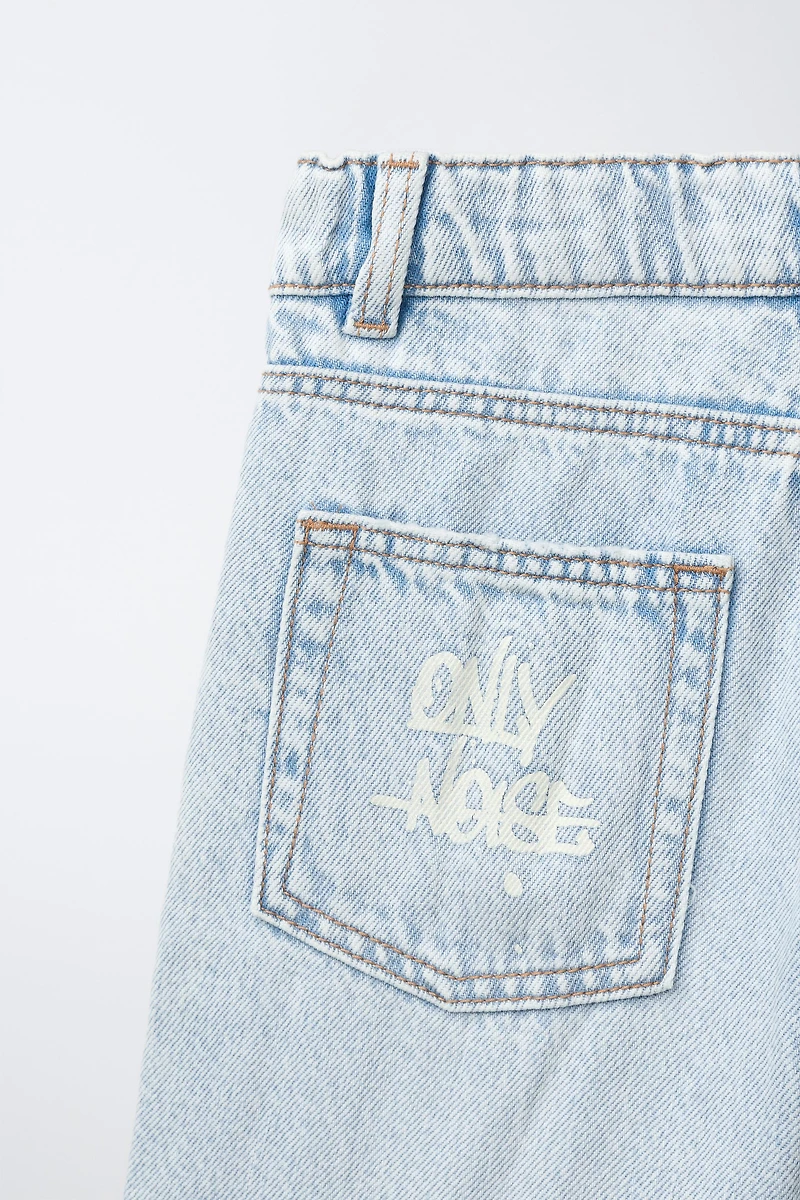 RIPPED AND GRAFFITI DENIM SHORTS