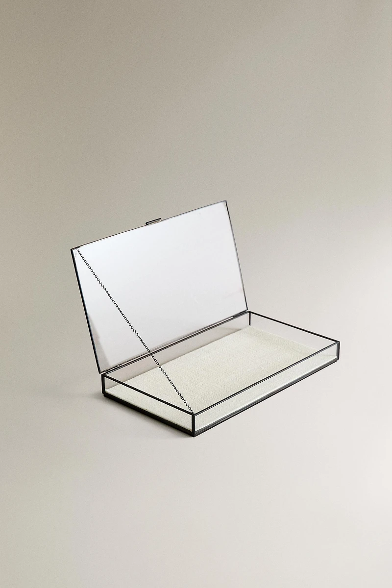 JEWELRY BOX WITH A BLACK METAL BORDER