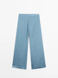 Flowing palazzo trousers with slits