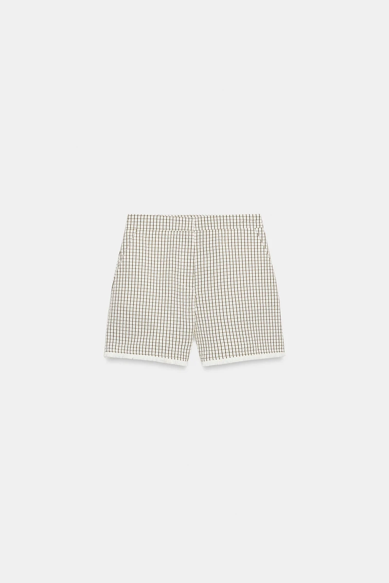 DISTRESSED PLAID SHORTS