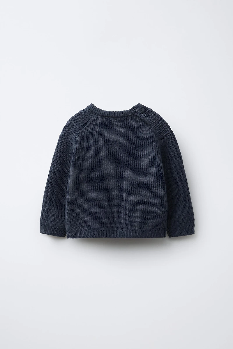 PULL EN MAILLE PERLÉE AVEC POCHE