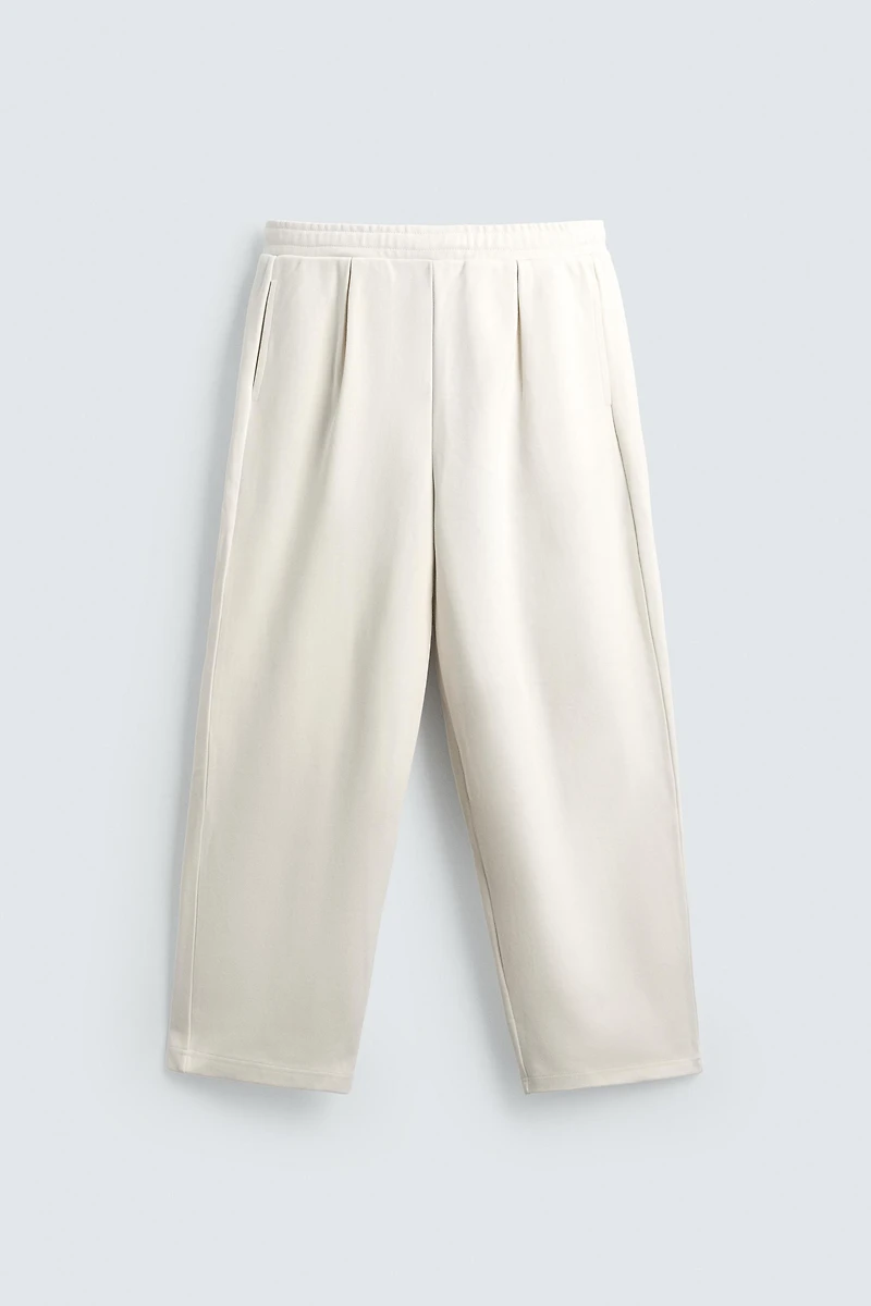 PLEATED WIDE FIT JOGGER PANTS