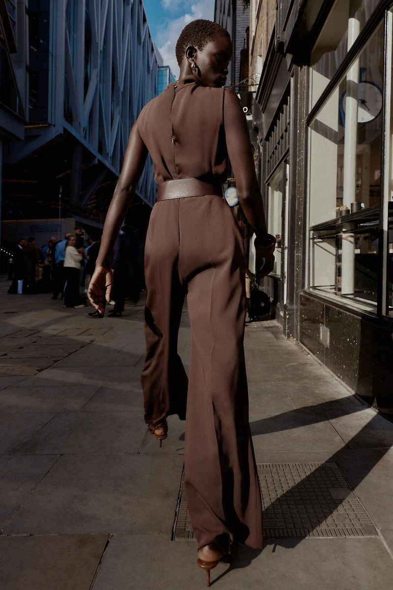 SLEEVELESS BELTED JUMPSUIT