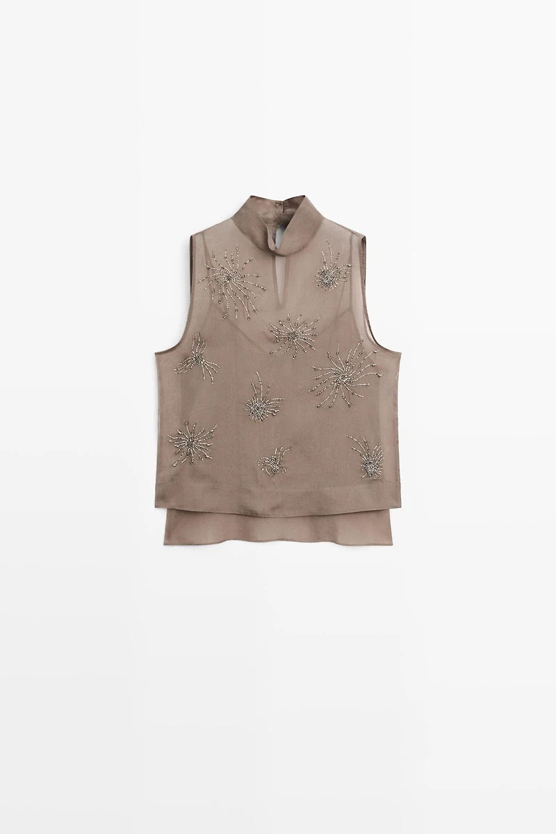 Top semi-transparent avec broderies