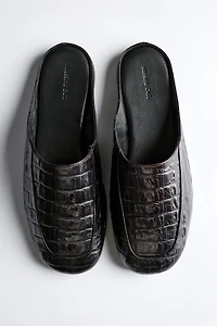 Mules en cuir façon croco