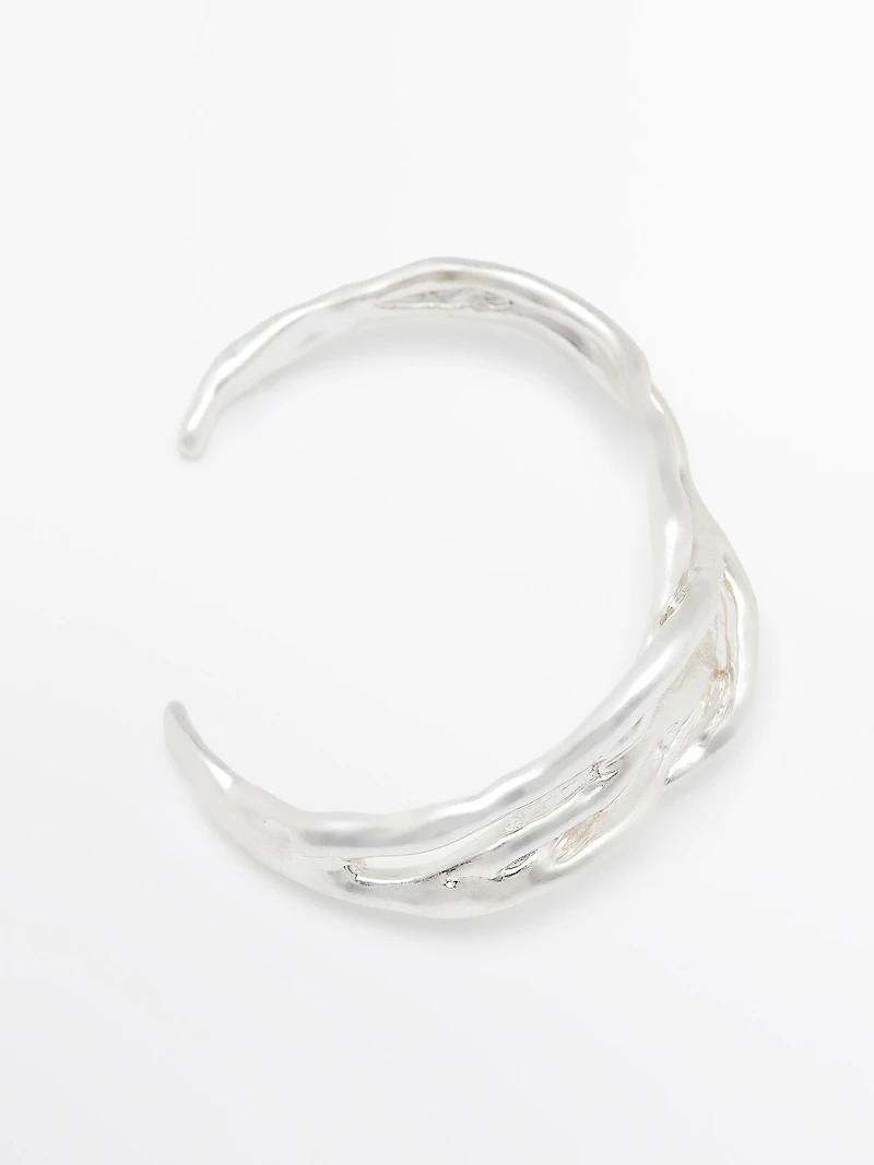 Bracelet métallique abstrait