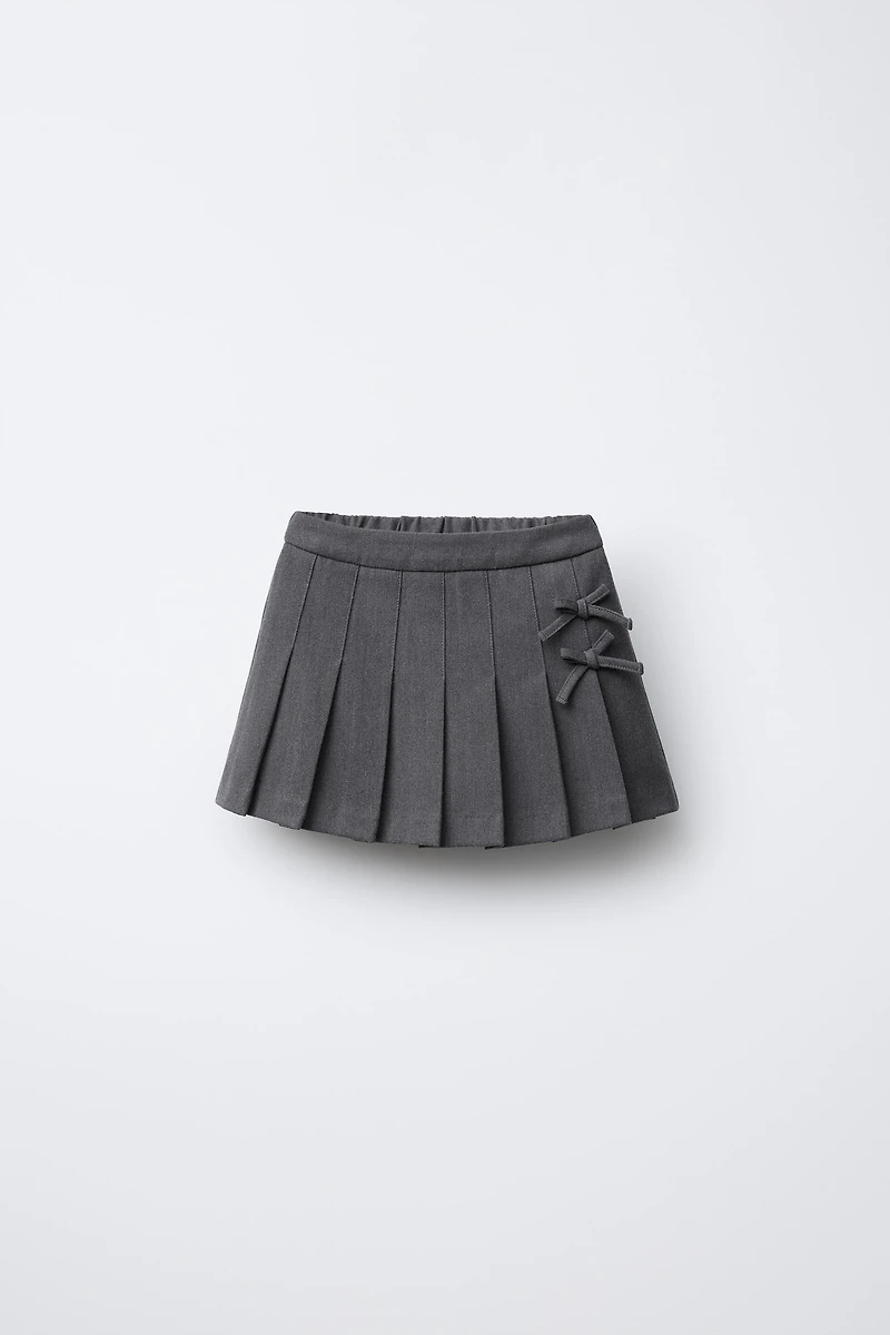 JUPE-SHORT PLIS PLATS LACETS