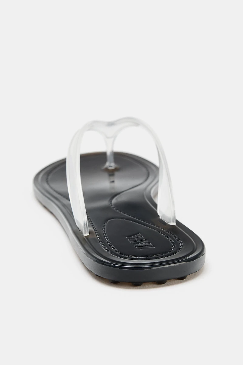 SANDALES PLATES EN VINYLE