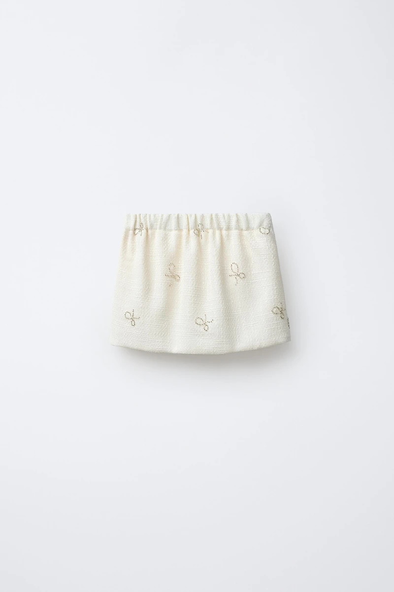SHINY BOW TEXTURED SKIRT
