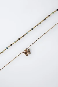 LOT DE DEUX COLLIERS À PERLES PAPILLON