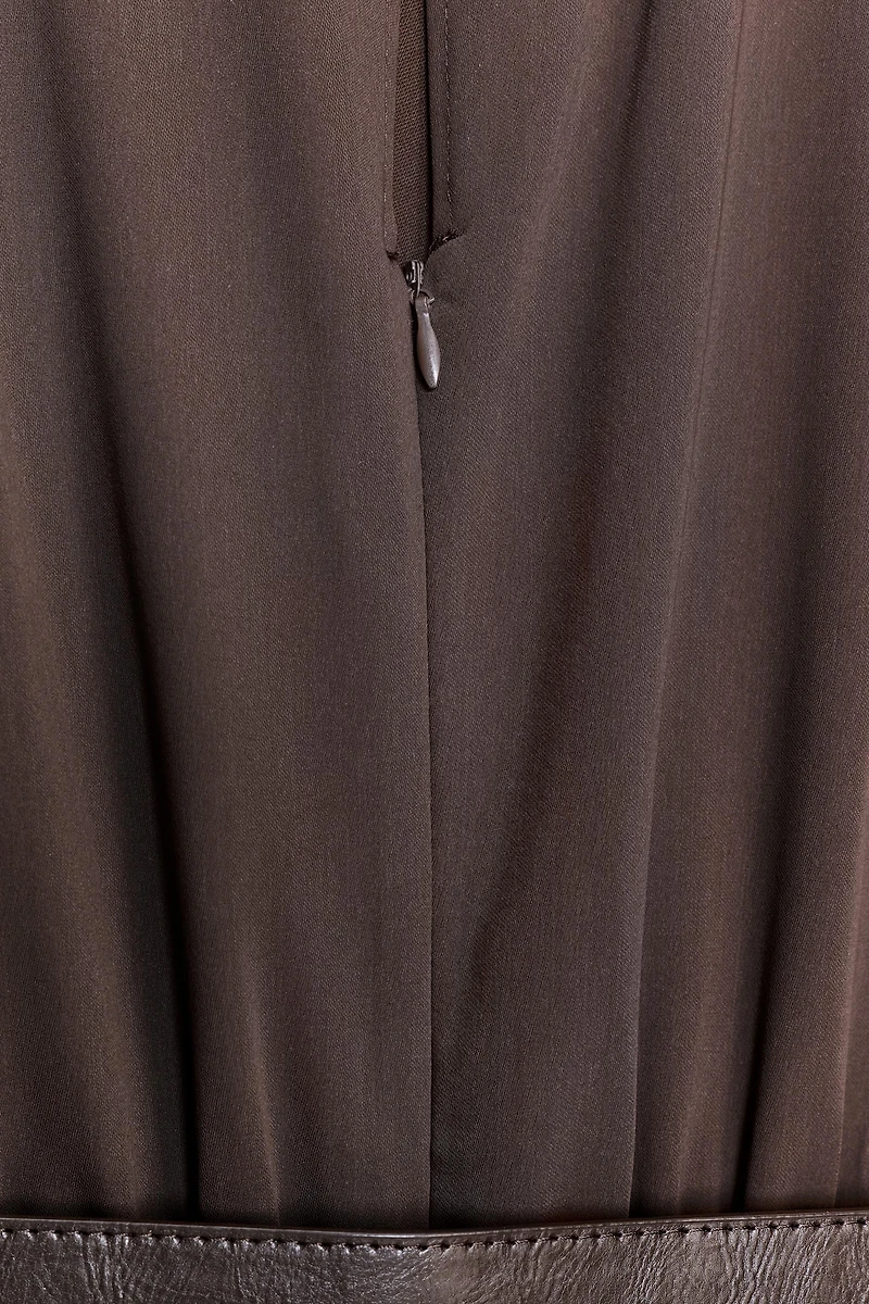 SLEEVELESS BELTED JUMPSUIT