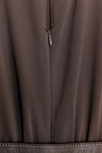 SLEEVELESS BELTED JUMPSUIT