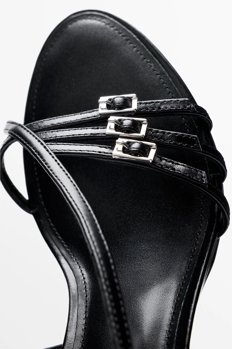 Leather heeled sandals with buckles