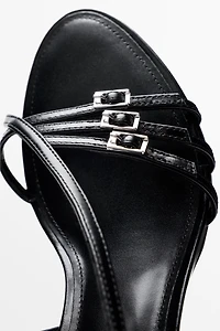 Leather heeled sandals with buckles