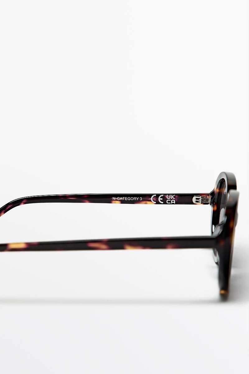 Oval tortoiseshell-effect sunglasses