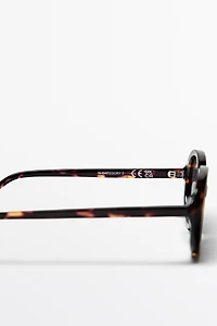 Oval tortoiseshell-effect sunglasses
