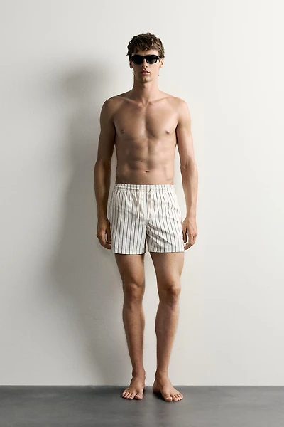 STRIPED MID-LENGTH SWIM TRUNKS