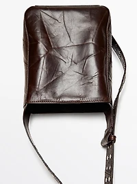 Nappa leather bucket bag with studs