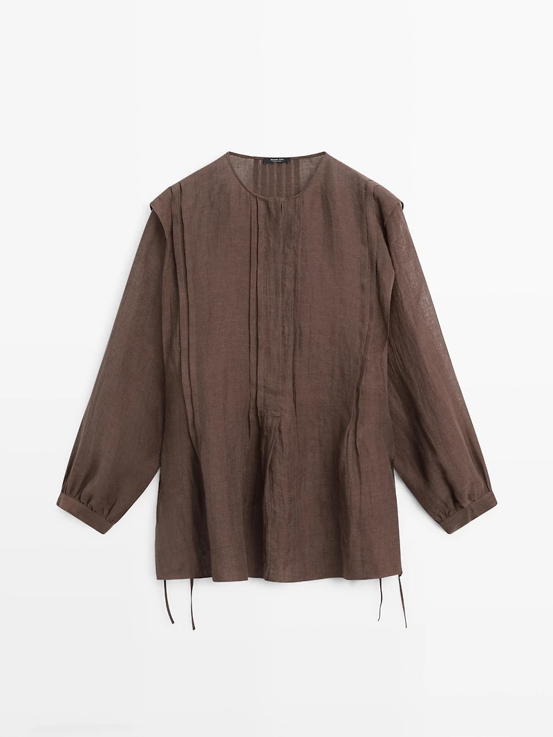 Flowing oversize linen blouse with ruffles