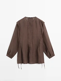 Flowing oversize linen blouse with ruffles