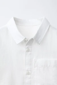 CHEMISE UNIE À POCHE