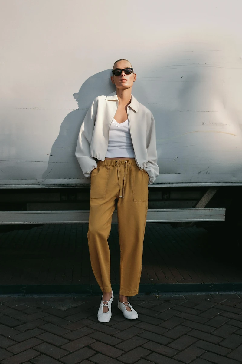 BALLERINES EN CUIR AVEC SURPIQÛRES