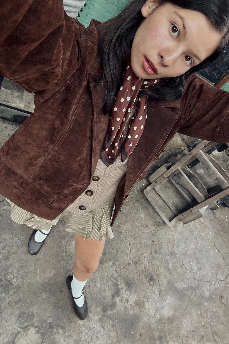 GILET EN MAILLE FINITIONS CÔTELÉES