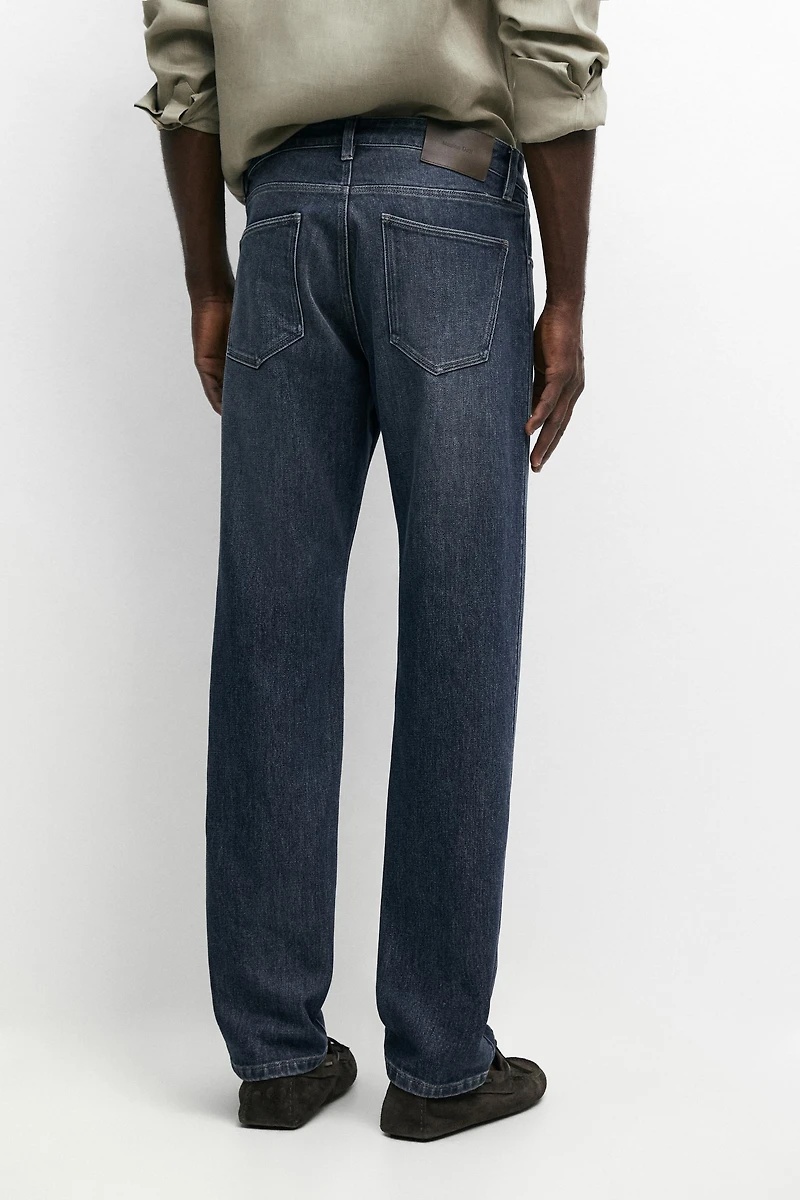 Enzymatic tapered fit jeans