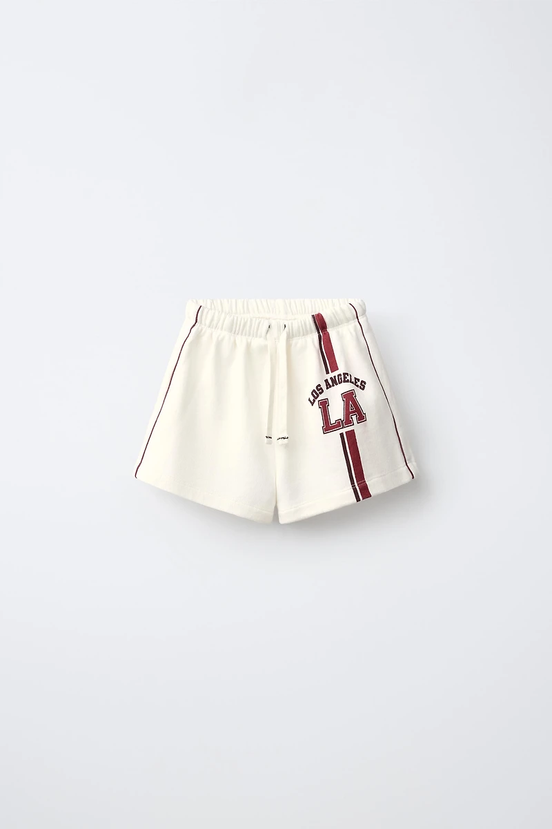 CONTRAST PIPING TEXT SHORTS