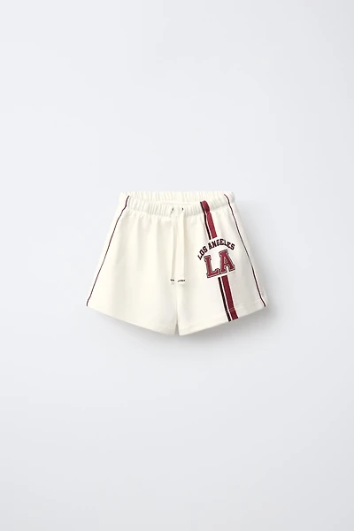 CONTRAST PIPING TEXT SHORTS