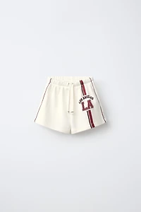 CONTRAST PIPING TEXT SHORTS