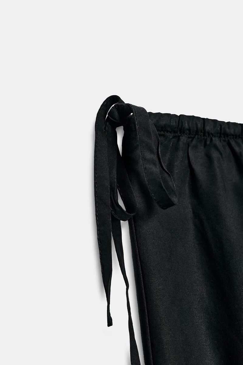 TIED ANKLE-LENGTH FLOWY PANTS