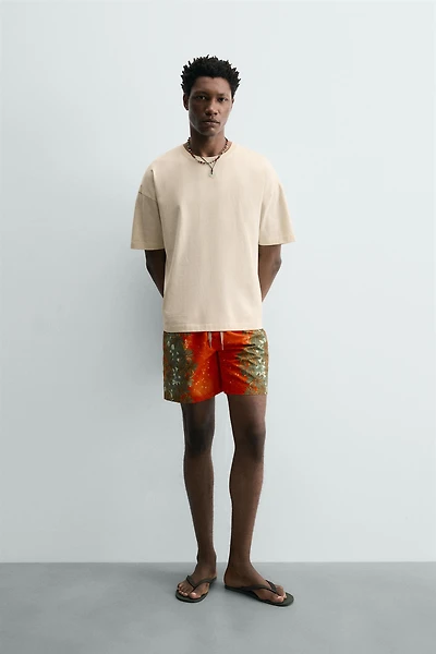 LONG FLORAL PRINT SWIM TRUNKS