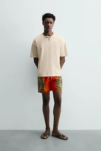 LONG FLORAL PRINT SWIM TRUNKS