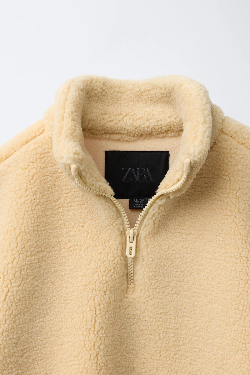 ZIP FAUX SHEARLING SWEATSHIRT