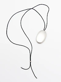 Leather cord necklace with metal piece