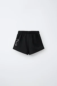 SEQUIN NUMBER PATCH SHORTS