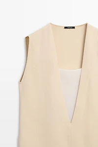 Flowing double-layer top with contrast detail