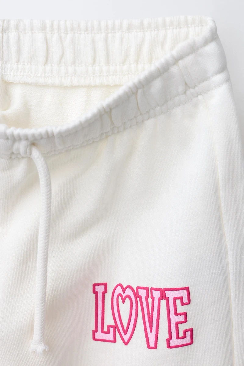 WIDE LEG VARSITY JOGGING PANTS