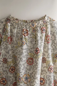 BABY FLORAL FOOTED ROMPER