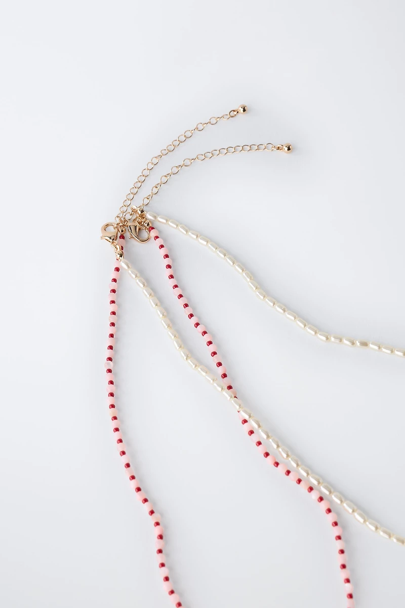 PACK OF TWO PEARL AND SEA BEAD NECKLACES