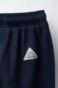 PANTALON STRUCTURÉ AVEC ÉTIQUETTE