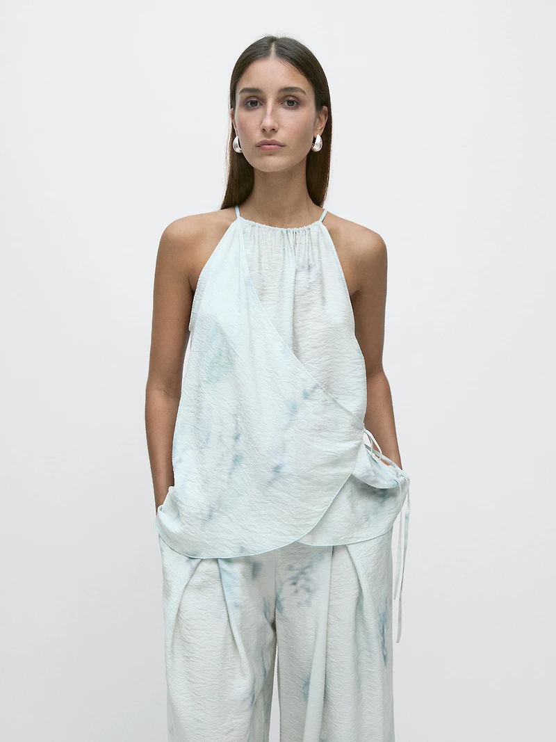 Flowing halterneck top with tie detail