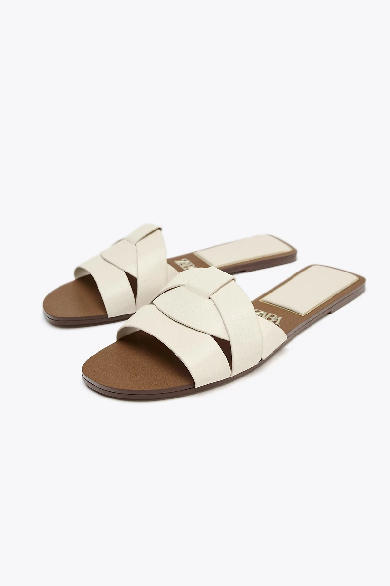 FLAT CROSSED LEATHER SANDALS