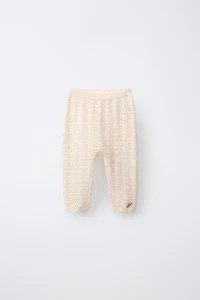PANTALON EN MAILLE AJOURÉE FLEURS BRODÉES