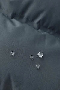 MANTEAU REMBOURRÉ ÉTIQUETTE DÉPERLANT