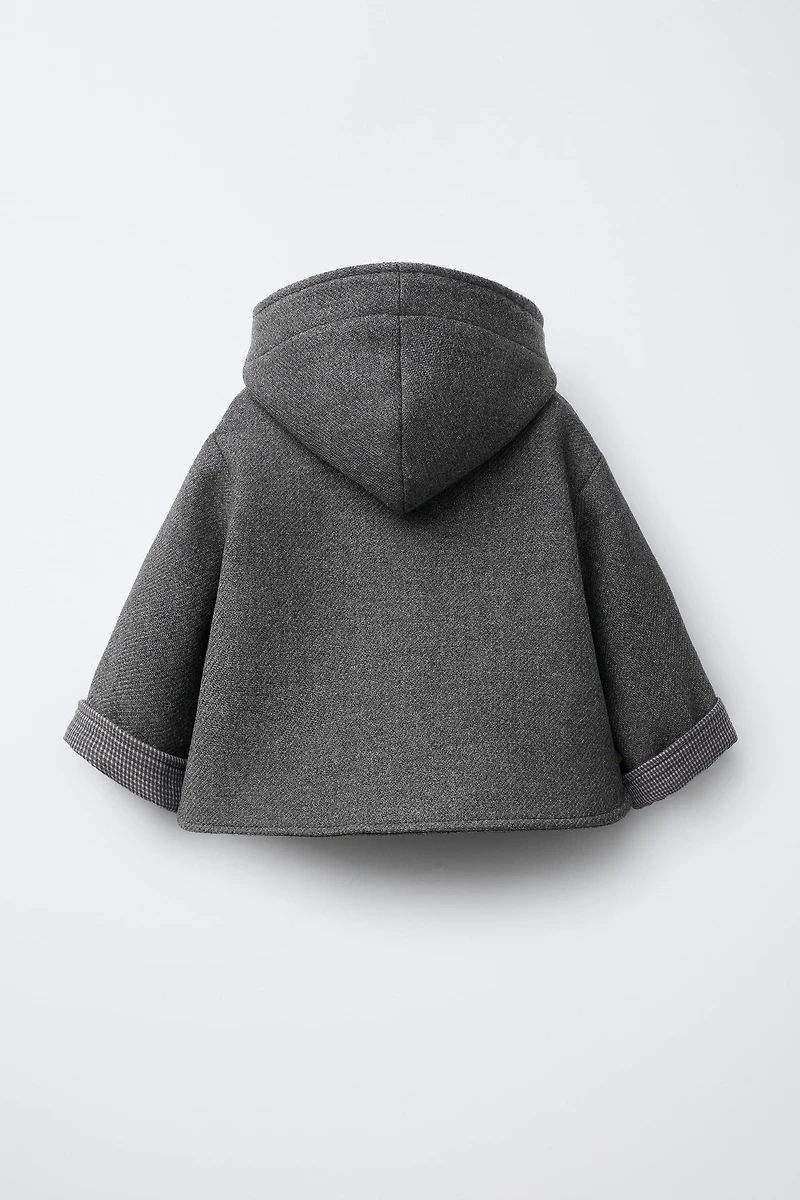 MANTEAU MANTECO À CAPUCHE