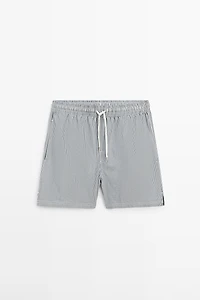 Swimming trunks with striped details