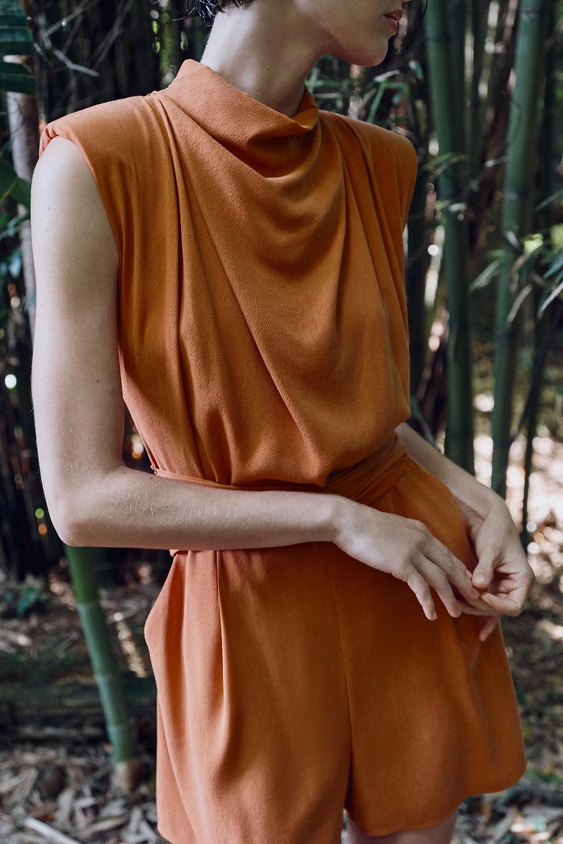 BELTED SHOULDER PAD JUMPSUIT