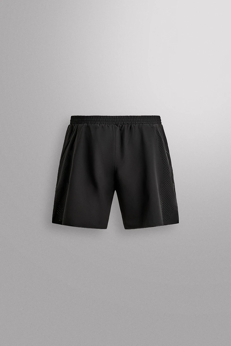 SHORT EN TISSU PERFORÉ 9''